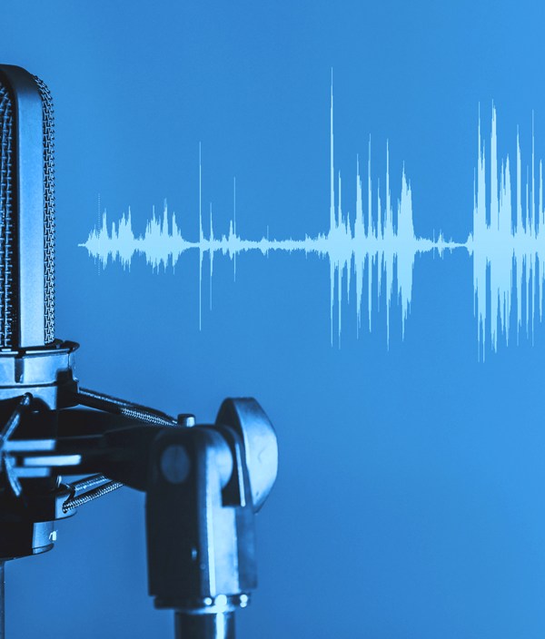 Blue graphic with podcast mic and audio waves