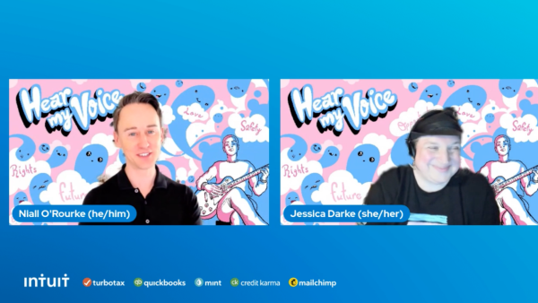 A screen grab of two professionals with pink and blue artwork behind them.