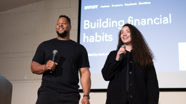 Ndamukong and Katya Suh on stage for one of our financial literacy workshops.