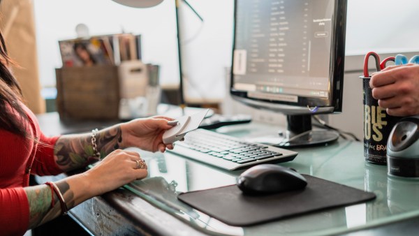 Female hands typing on computer